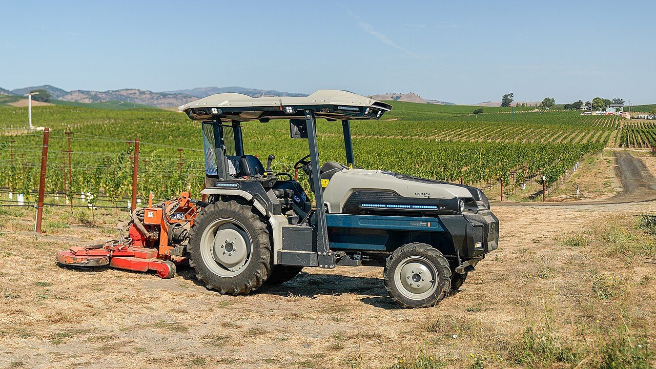 Monarch MK-V beside vineyard rows