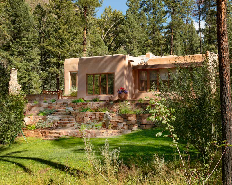 Country home among mature trees and landscaped grounds