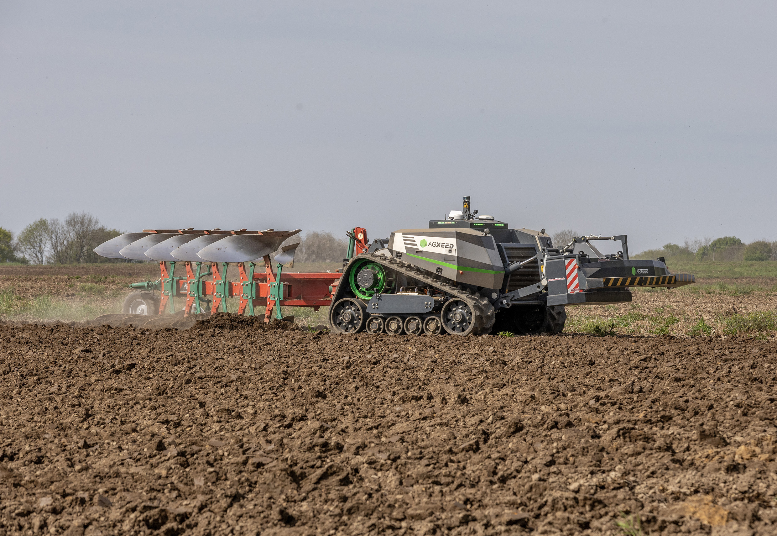 AgXeed AgBot 5.115T2 ploughing a field
